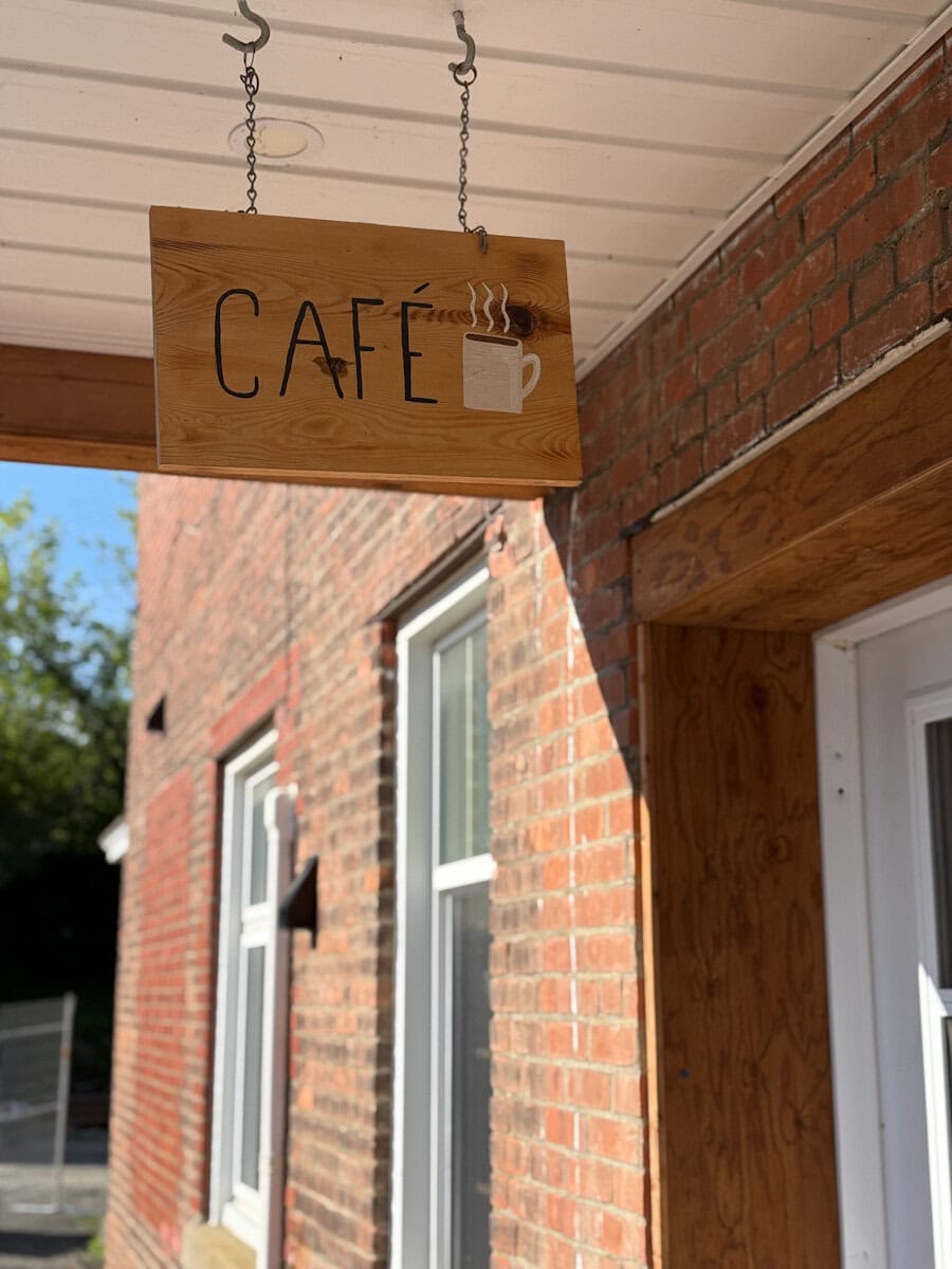 Early Bird coffee house campbellton, brick wall entrance and sign